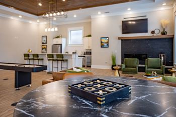 a game table in a living room with a fireplace